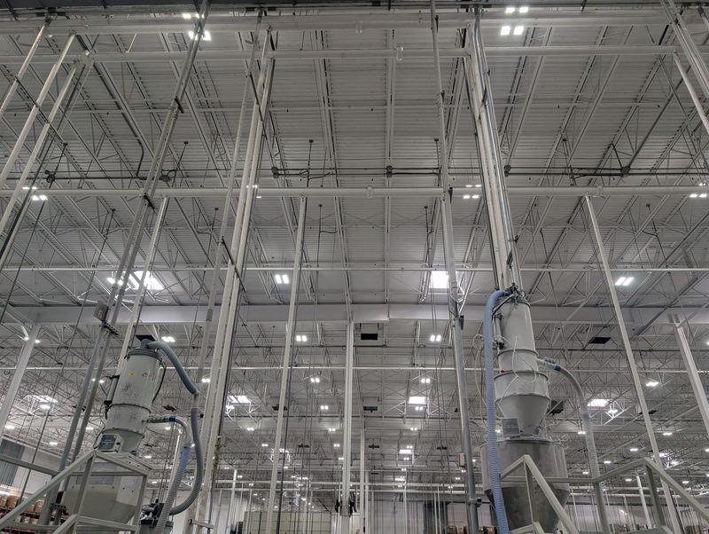 High-bay LED lighting throughout a large warehouse interior.