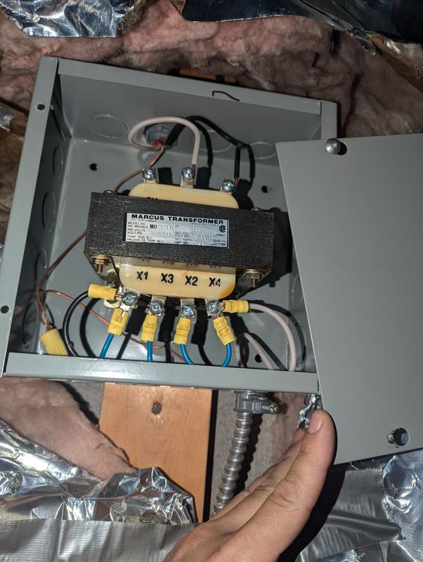 Control transformer in an enclosure being terminated above a commercial ceiling