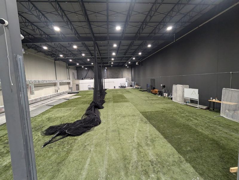 Indoor turf sports facility lit by LED high-bay fixtures